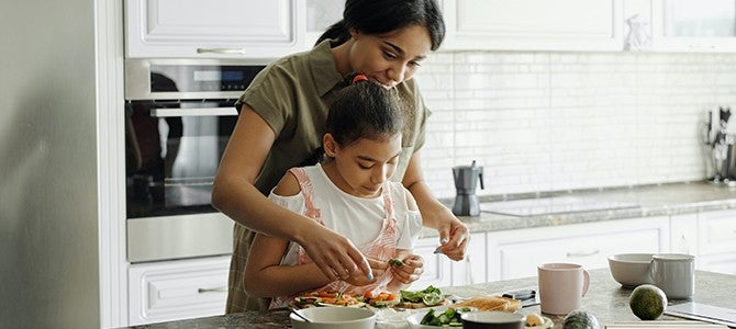 Vitamin D Image - 03 mother and daughter cooking in the kitchen